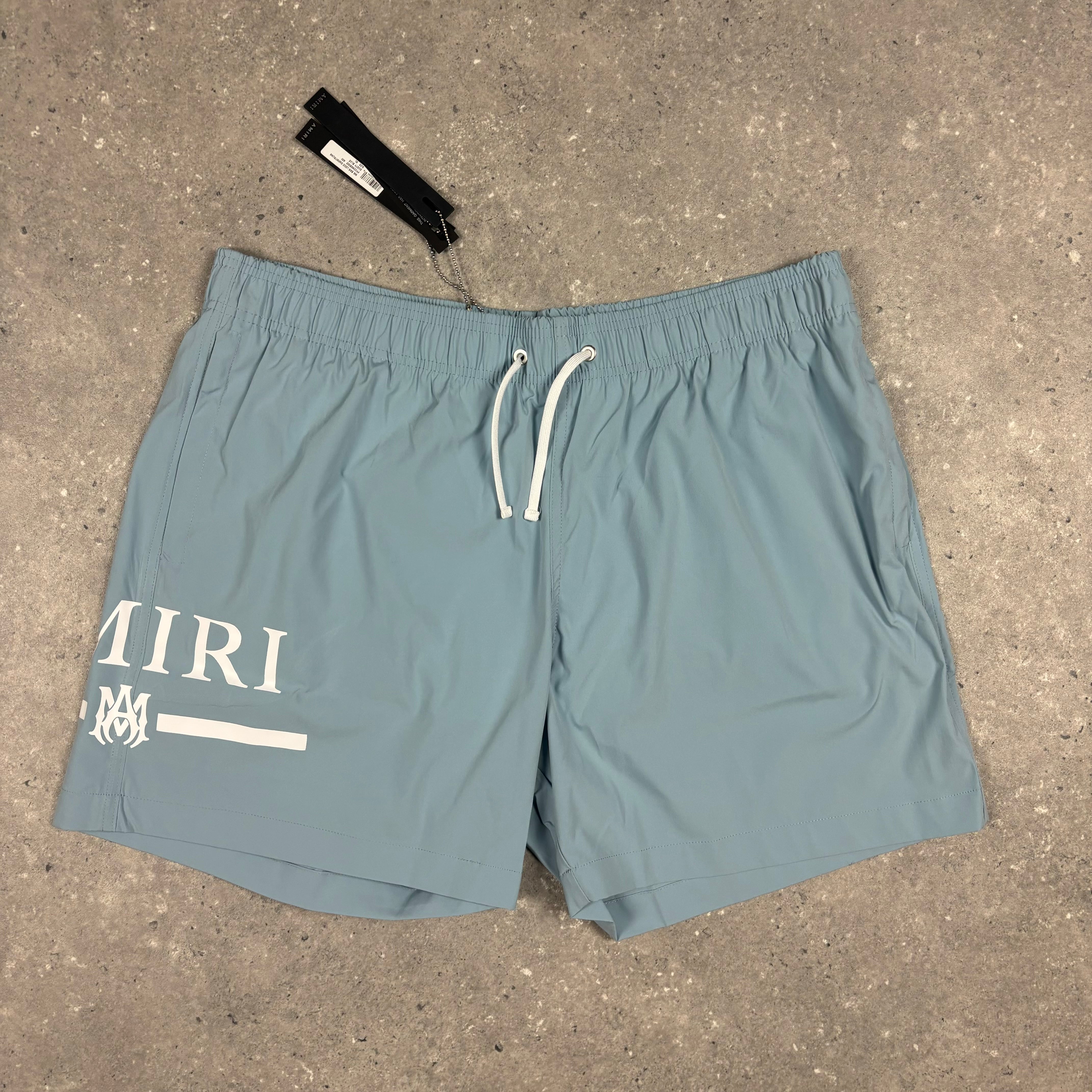 AMIRI DUSTY BLUE SWIM SHORTS