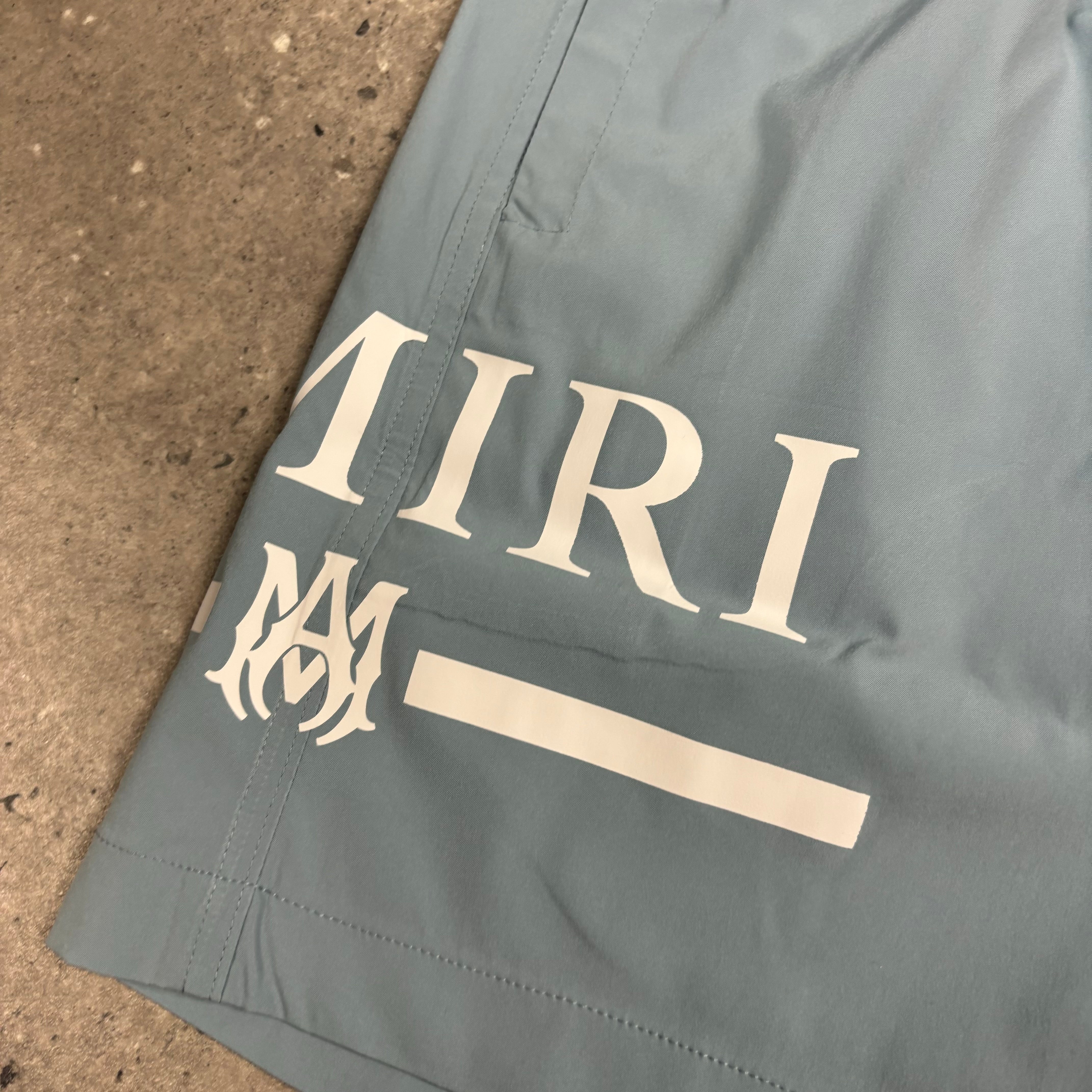 AMIRI DUSTY BLUE SWIM SHORTS
