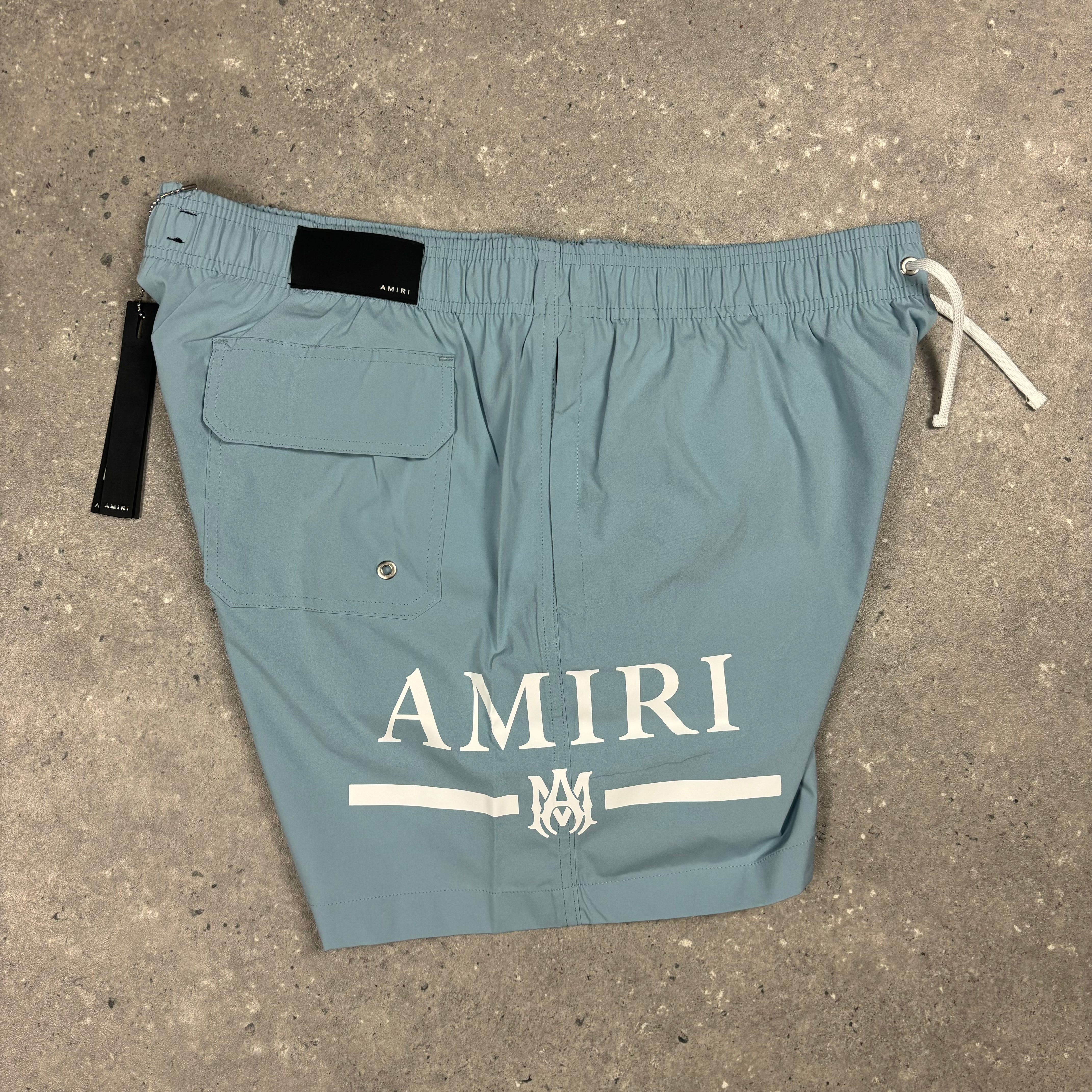 AMIRI DUSTY BLUE SWIM SHORTS