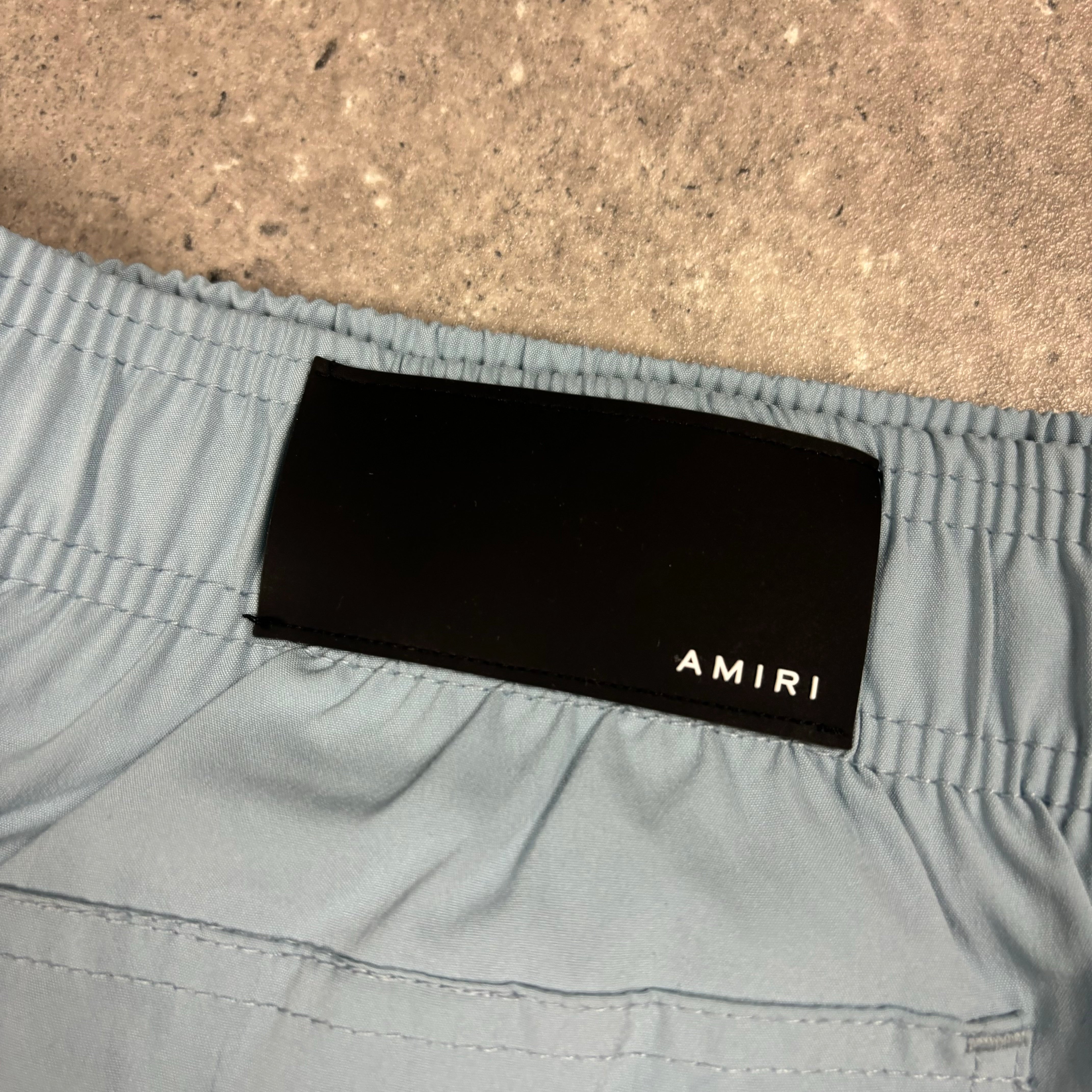 AMIRI DUSTY BLUE SWIM SHORTS